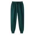 Dettaglio di pantaloni sportivi verde scuro con coulisse e polsini a coste alle caviglie - Verde Scuro