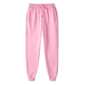 Dettaglio dei pantaloni sportivi rosa con vita elastica, coulisse e tasche laterali - Rosa