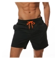 Detail of men's black quick-dry swim trunks featuring contrast bright orange drawstring - Black / S