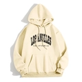 Beige oversized hoodie with Los Angeles lettering and kangaroo pocket in flat lay view - Apricot (LOS ANGELES CALIFORNIA)