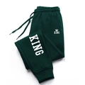 Pantaloni jogger verde scuro con coulisse elastica in vita e stampa grafica KING bianca - M / Verde/Bianco