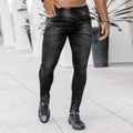 Close-up of men's skinny fit jeans in dark grey wash with classic five-pocket design - S / Black