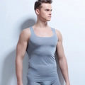 Detail of grey seamless compression vest for men showing laser-cut edges and elastic fabric - M / Gray