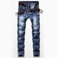 Detail of acid wash denim texture with 3D crinkle effects and a brown leather belt - EU 28 / 910 Blue