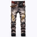 Men's slim distressed jeans with gold wing embroidery and vintage washed finish - EU 29 / Blue
