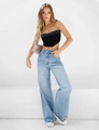 Close-up of high waisted wide leg jeans in light blue denim with satin tube top - XS / Bottoms / Dark Blue