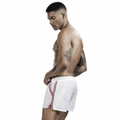 Detail of white men's athletic shorts with red and blue side stripes and drawstring waist - M / White