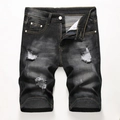 Detail van heren denim shorts met gaten en vintage vervaagde zwarte spijkerstof structuur - EU 28 / Zwart
