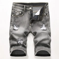 Detailweergave van grijze gewassen denim short met gescheurde details en metalen knoop - EU 28 / Grijs