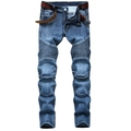 Détails des plis de style motard et de la texture denim délavé sur ce jean bleu - EU 29 / Bleu