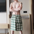 Men's loose plaid lounge shorts featuring a green and yellow checkered pattern and elastic waist - M / Yellow Plaid