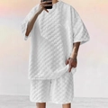 Detailed macro view of white waffle textured fabric on loose fit men's casual two-piece set - S / White