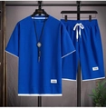 Detail von blauem Waffelstrick-Set mit weißem Saum und strukturierter Gewebeoberfläche - M / Oberteil Und Unterteil / Blau