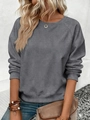 Detail of dark grey crew neck sweatshirt with raglan sleeves and ribbed cuffs on a model - S / Dark Gray