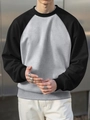 Detail of raglan sleeves and ribbed cuffs on a gray and black contrast sweatshirt - S / Black Sleeve + Light Grey