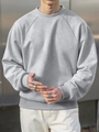 Detail of grey crewneck sweatshirt featuring raglan sleeves and ribbed cuffs in a street style - S / Light Gray