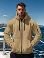 Close-up of khaki hooded jacket featuring orange zippers and multi-pocket functional design - S / Khaki