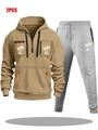 Gros plan détaillé du sweat à capuche kaki avec imprimé cocotier blanc et poches zippées - M / Haut Et Bas / Kaki Et Gris Clair