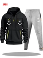Detail view of men's black half-zip hoodie and grey joggers with smiley pocket designs - S / Black And Light Grey