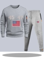 Grey athletic tracksuit set with numbered prints and contrast zip details on a flat lay - S / Top And Bottom / Light Gray