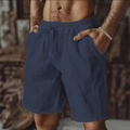 Detail of navy blue cotton linen shorts featuring elastic drawstring waist and pockets - Dark Blue