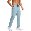 Detail of light blue sports joggers featuring elastic waist and zipper pockets - M / Light Blue