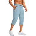 Detail of light blue quick-dry capri pants featuring a black zipper with neon yellow pull cord - M / Light Blue