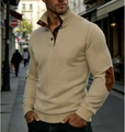 Close-up of beige knitted sweater featuring brown elbow patches and a buttoned high collar - Khaki