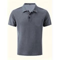 Detailed view of grey waffle knit polo shirt with chest pocket and three-button collar - S / Tops / Light Gray