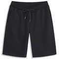 Men's loose black athletic shorts with elastic waistband and drawstring in flat lay view - Black