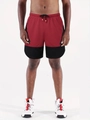 Detail of red and black men's running shorts featuring elastic drawstring waist and mesh fabric - Red & Black