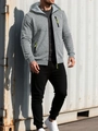 Detail van de grijze gebreide hoodie met neon groene ritsaccenten en textuurstof - S / Lichtgrijs