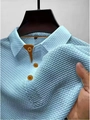 Detail of light blue waffle knit polo shirt showing elastic texture and contrast collar - Light Blue