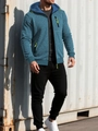 Detail of teal jacquard waffle hoodie with fluorescent green zipper and chest pocket - Denim Blue