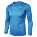 Detail of blue compression shirt showing orange stitching and breathable fabric texture - Sapphire Blue