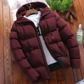 Detail view of wine red men's padded hooded jacket with zipper pockets and drawstrings - Burgundy