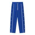 Détail du jogging bleu avec bandes latérales blanches, boutons-pression et cordon de serrage - Bleu saphir