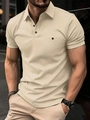 Slim fit beige men's polo shirt with short sleeves and rib-knit cuffs on city street - S / Apricot