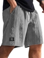 Detailed close-up of grey cable knit shorts featuring textured fabric and white drawstrings - S / Gray