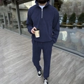 Detail view of navy blue corduroy tracksuit with half-zip collar and ribbed texture - Navy Blue