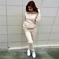 Detail of beige fleece tracksuit featuring drawstring hoodie with pocket and matching joggers - Khaki