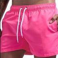 Men's quick-dry swimming shorts in vibrant peach pink with adjustable white drawstring - M / Rose Red
