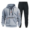 Dettaglio felpa con cappuccio celeste con zip arancione e pantaloni sportivi neri con coulisse - Taglia M / Grigio chiaro/Nero