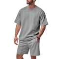 Detailed view of grey knitted men's summer set with textured jacquard cable pattern - Gray