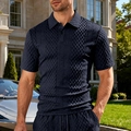 Dettaglio del set polo blu scuro con trama a rombi e coulisse in vita dei pantaloni - S / Tops / Blu navy