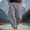 Detail of grey men's linen pants featuring drawstring waist and large front pockets - S / Gray