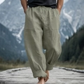 Close-up of light green linen blend fabric texture and drawstring waist on men's casual pants - S / Army Green