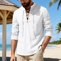Linen beach shirt detail with lace-up V-neck and rolled sleeves in outdoor setting - S / Tops / White