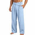 Detail der hellblauen Leinenhose mit hoher Taille, Knopf-Design und Stoffstruktur - Hellblau