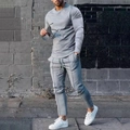 Close-up of men's gray tracksuit featuring drawstring waist and elastic tapered cuffs - M / Light Grey Set